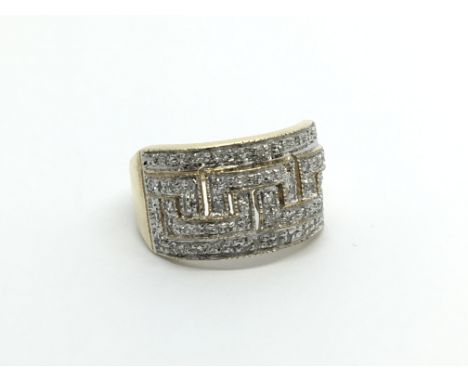 A 9carat gold ring set with a pattern of diamonds approximately 0.25 of a carat. ring size M
