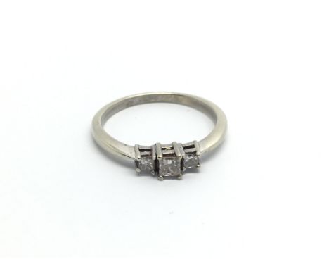 A 9carat white gold ring set with three princess cut diamonds approximately 0.15 of a carat ring size M