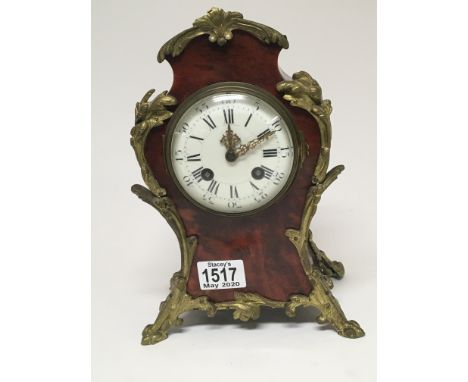 A late 19th century French mantel clock with gilt metal mounts with a white enamel dial the movement striking on a gong Hight