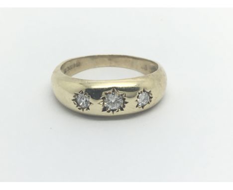 A 9carat gold Gypsy type ring set with three diamonds Approximately 0.20 of a carat. Ring size O-P