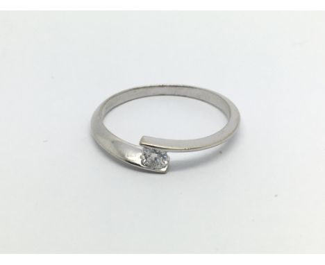 An 18carat white gold ring set with a solitaire diamond ring size 0.15 of a carat. ring size P