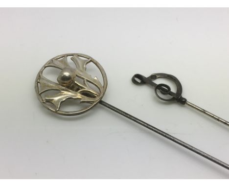 Two Charles Horner silver hatpins, one in the form of a thistle, the other of a treble clef.