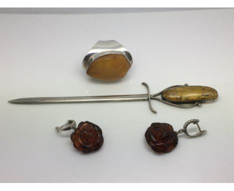 Silver and amber items comprising a pair of earrings, ring and a letter opener.