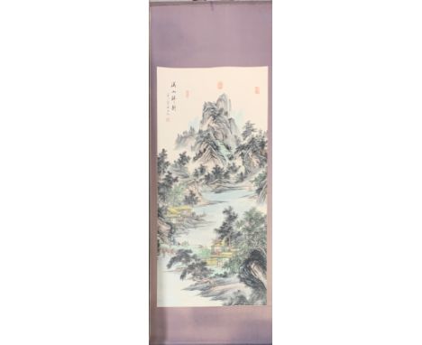 A Chinese silk mounted printed scroll of a mountain landscape, 69 x 180cm.