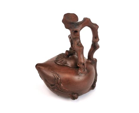 A Chinese naturalistic peach shaped Yixing terracotta teapot, H. 17cm.