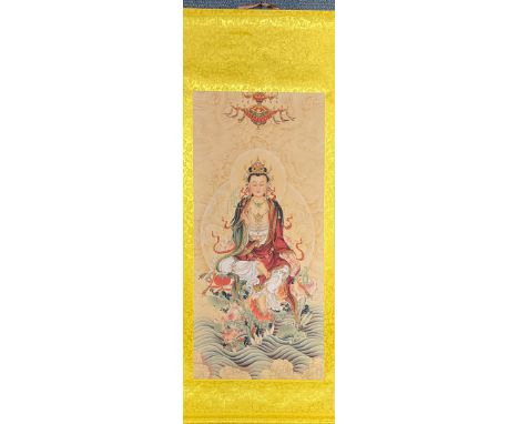 A fine Chinese print on a silk-mounted scroll of the goddess Guanyin, scroll size 67 x 189cm.