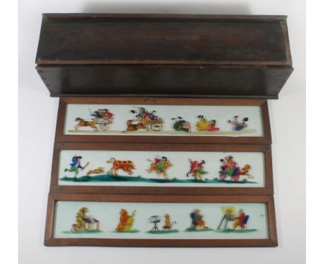 A collection of vintage wooden framed magic lantern slidesDepicting a range of various subjects including street sellers, var
