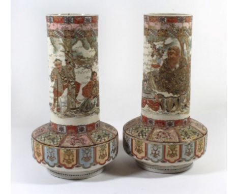 A pair of Japanese Satsuma vases, Meiji periodEach decorated with figures playing musical instruments and in landscapes, heig