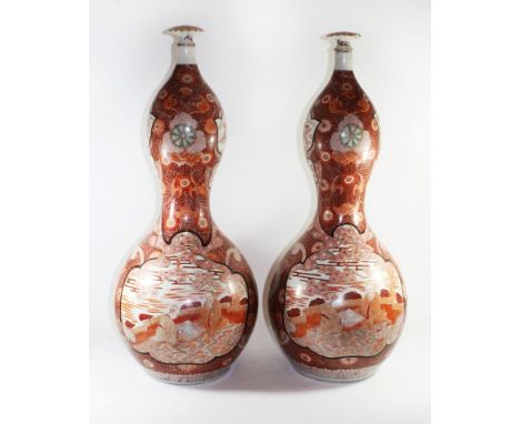 A pair of Japanese Double Gourd floor vases, Meiji periodPainted with a couple playing Go, six character signature to base, h