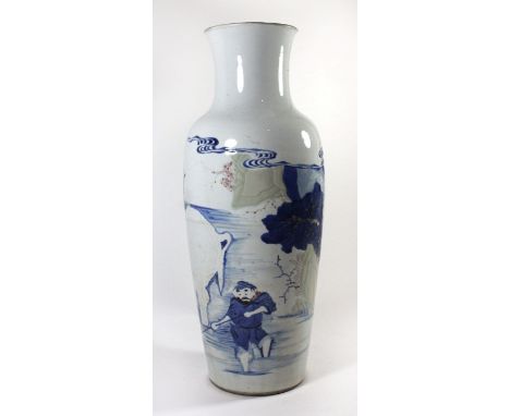 A Chinese blue and white vase, 19th Century Having embossed decoration depicting figures washing an elephant with copper red 