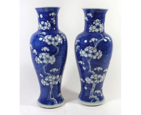 A pair of Chinese blue and white porcelain vasesEach painted with Prunus flowers, each bears Kangxi double ring mark to base,