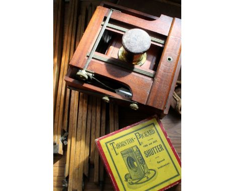 A mahogany and brass folding plate field cameraFitted with lens marked Laverne and Co, 7.5x5 rapid symmetrical, Paris, togeth