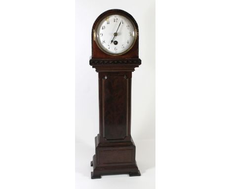 An early 20th Century miniature longcase clockWith white enamel dial and Arabic numerals to a brass movement, the mahogany ca