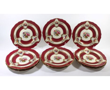 A set of twelve Copeland Spode cabinet platesDecorated with central bouquet of flowers surrounded by a red and gilt highlight