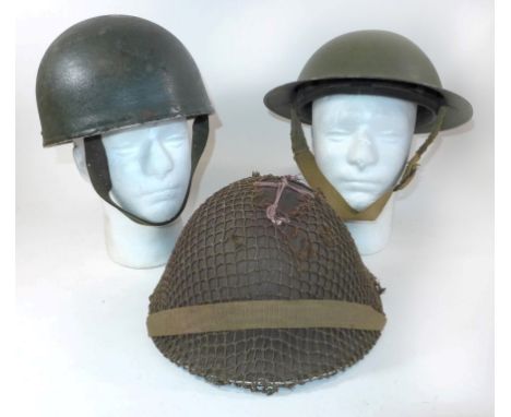 A British Army despatch riders green painted helmet, mid 20th CenturyA green painted helmet and a post WWII period helmet wit