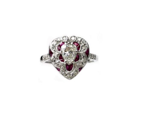RUBY AND DIAMOND RING, set with a central pear shaped diamond, flanked by calibre cut rubied and smaller round brilliant cut 