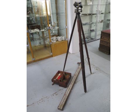 A surveyors level no 3822 by Charles Baker of London together with a tripod and staff 