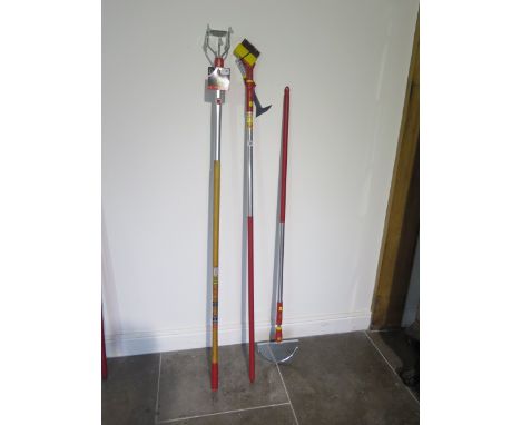 A set of three Wolf garden tools with interchangeable handles 