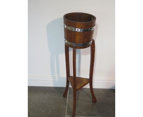 An oak barrell type plantstand by R Alister &amp; Co - height 92cm x diameter 27cm - rickerty, needs attention 