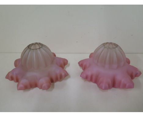 A pair of pink glass light shades - Width 15cm x Height 9cm - both generally good 