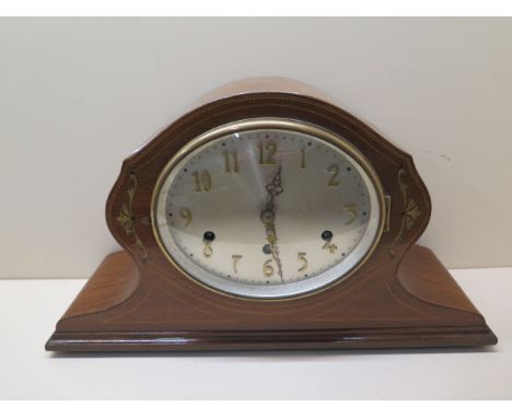 A walnut inlaid chiming mantle clock in generally good condition - running with key - width 45cm x height 26cm 