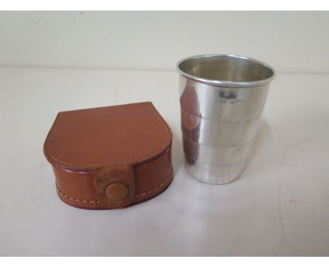 A silver folding hunting cup - height 7cm - Chester 1914/15 maker Cy &amp; Co in an associated leather case - some small dent