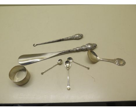 A silver napkin ring, Continental silver caddy spoon, mustard spoon, pair of salts, button hook and shoe horn - weighable sil