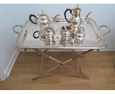 A large Cesa 1882 silver plated tray on a folding plated stand with an Arthur Price plated four piece tea service and a plate