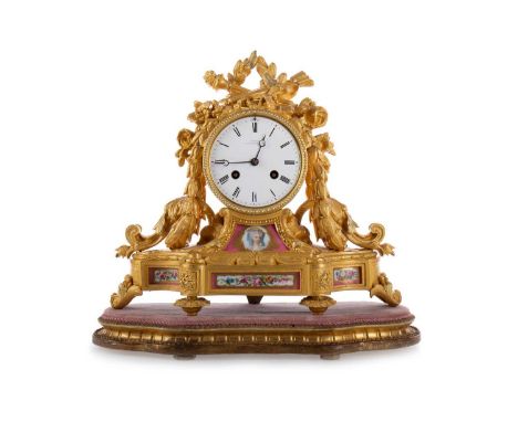 FRENCH ORMOLU AND PORCELAIN MANTEL CLOCK, LATE 19TH CENTURY with twin train eight day movement, the white enamel dial set wit