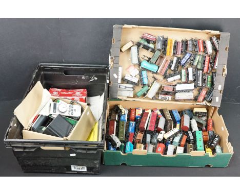 Around 100 OO gauge items of rolling stock to include Hornby, Lima, Bachmann etc featuring tankers, wagons and vans plus a gr