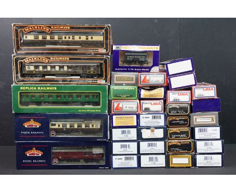 34 Boxed OO gauge items of rolling stock to include 12 x Bachmann, 6 x Palitoy Mainline, 9 x Dapol, 5 x Lima and 2 x Replica 