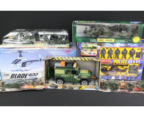 Quantity of mixed boxed toys to include Deluxe Action Figures Play Set Police Force, New Ray Battery Operated AH64 Apache, Ar