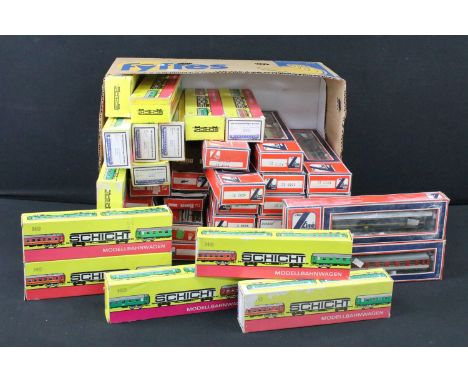 42 Boxed HO / OO gauge items of rolling stock to include 28 x Lima and 14 x Schicht, featuring coaches and wagons