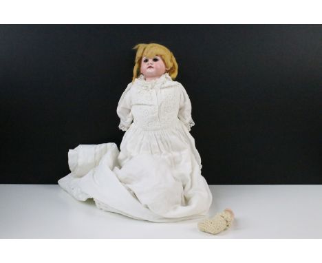 Armand Marseille bisque headed doll with brown sleeping eyes, hand painted facial features and blonde hair in long white fril