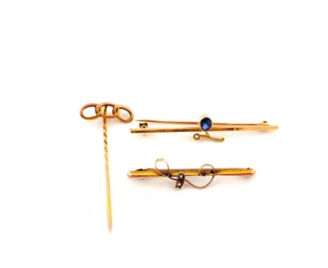 A 15ct bar brooch, a 9ct bar brooch and a 9ct stick pin