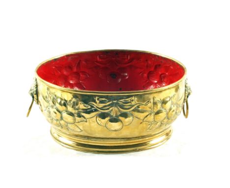 A 19th Century oval fruit embossed Brass planter with lion mask ring handles, 11" wide