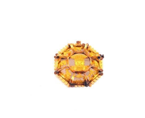 An Eastern Gold brooch