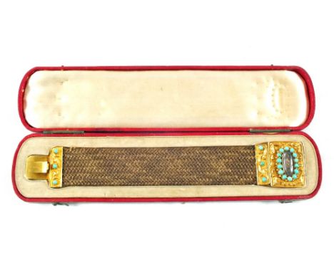 A cased Victorian hair bracelet with Gold mounts set with multiple Turquoise and floral decoration