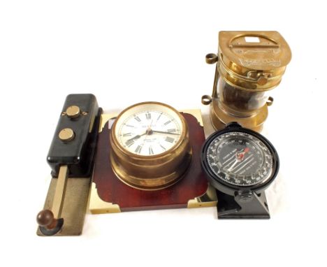 A ships clock, compass, reproduction mast head lamp and a morse tapper