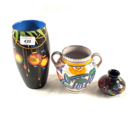 A small Moorcroft Iris vase, Poole floral vase and Crown Ducal Chinese lantern vase
