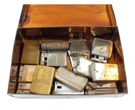 A tin containing fourteen various cigarette lighters