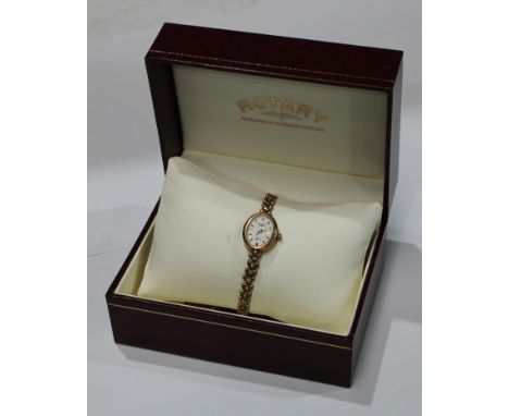 A lady's 9ct gold Rotary wristwatch with integral 9ct bracelet strap, two small spare links, 12.1g gross, boxed 