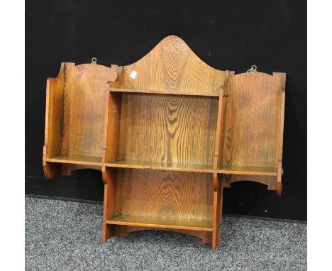 An Arts and Crafts oak wall shelf bracket 