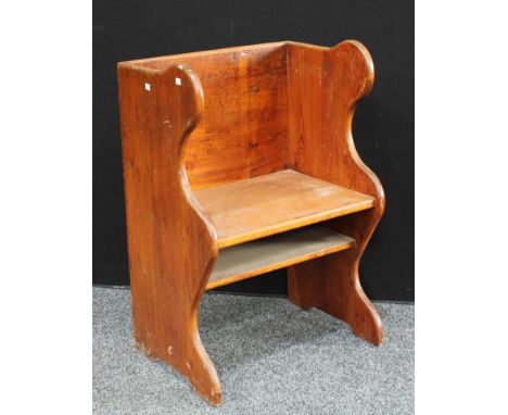 A rustic pitch pine farm house parlor chair, box back, shaped rounded sides, fixed panel seat, above under tier shelf, 95cm h