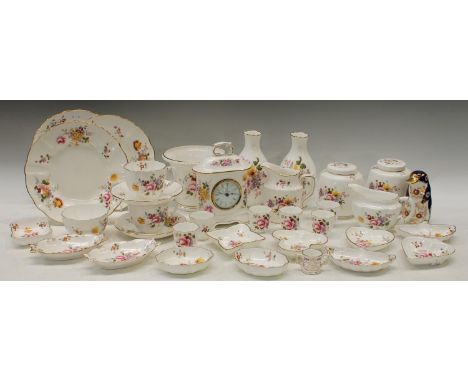 A Royal Crown Derby Posie pattern mantel clock, pair of ginger jars, jugs, cups and saucers, eggcups, milk and sugar; a Paper