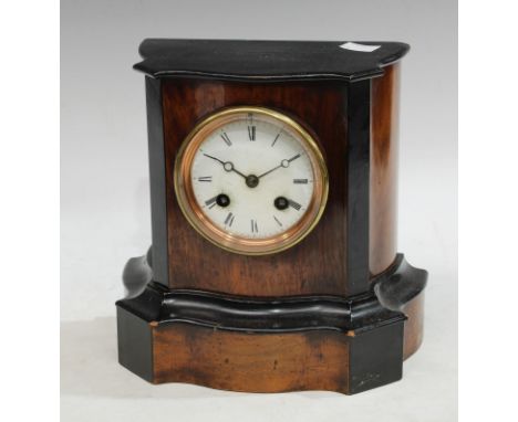 A Victorian walnut and ebonised mantel clock 