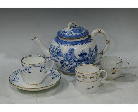 An early 19th century Derby spirally fluted coffee cup, painted with cornflowers; another Derby cornflower coffee can; a Roya