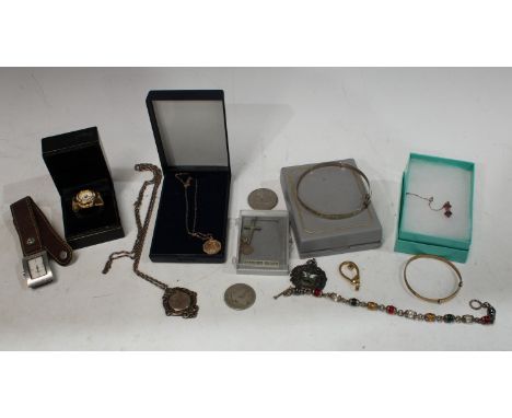 A 9ct gold child's bangle, 2.7g; a 9ct gold pendant and chain, 1.4g; a silver fob, Derby Hospital Day 1920, First Prize Fire 