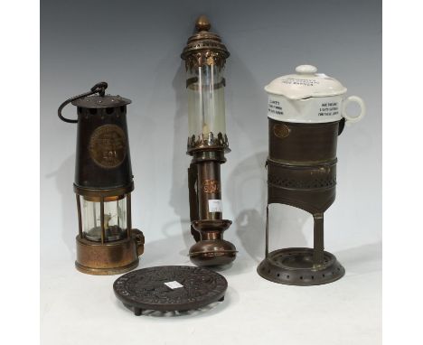 An Eccles miners lamp, type SL No.B120, 201; a GWR wall mounted oil lamp; a Sam L. Clarke's patent pyramid food warmer and st