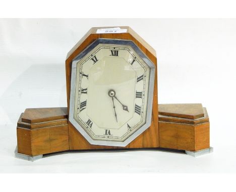 An Art Deco style mantel clock in a walnut case, with octagonal silvered dial, length 27cm 